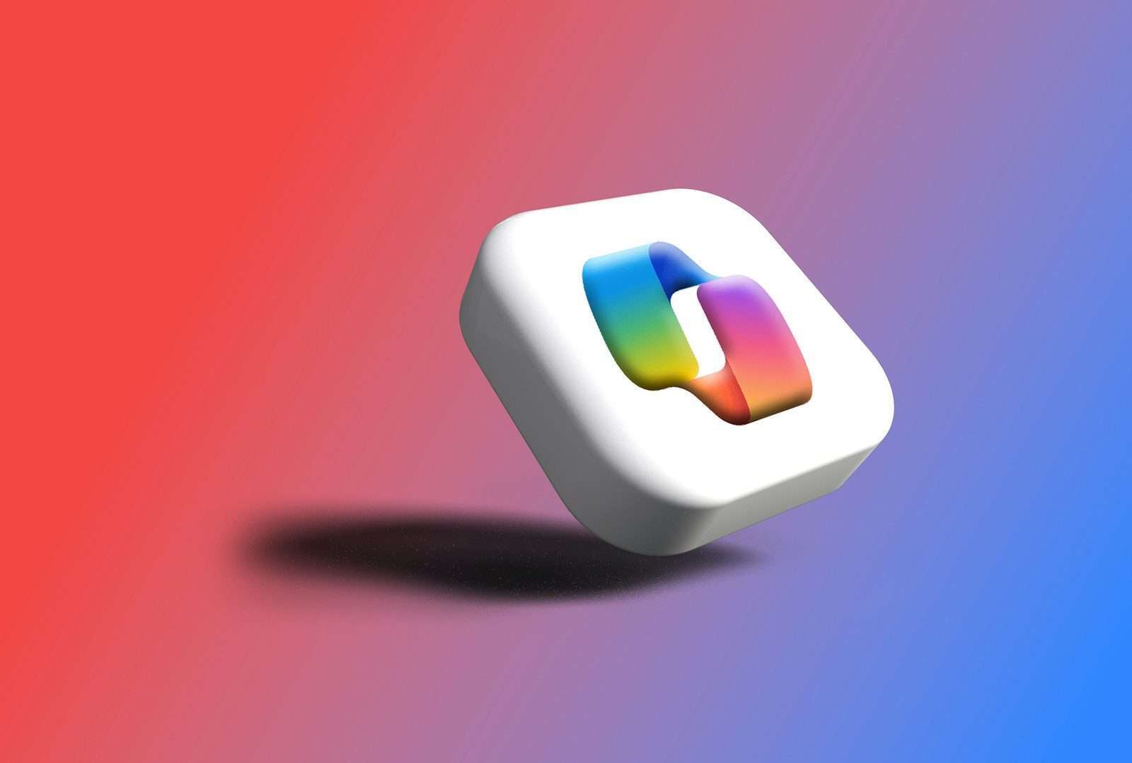 A white cube with a colorful abstract shape inside.